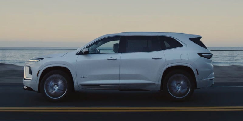 2026 Buick Enclave side profile driving on the road